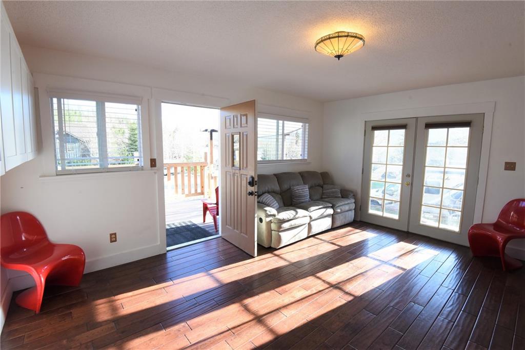 423 Big Elk Road Dillon, CO 80435 - Photo 16 of 35 a living room with furniture fireplace and wooden floor