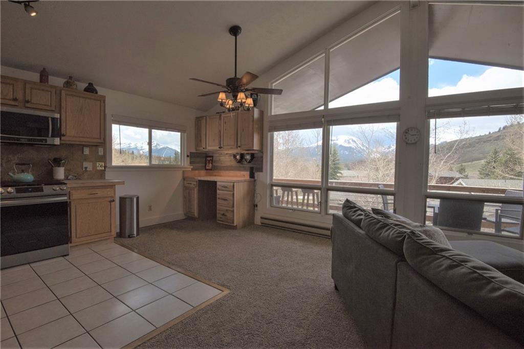 423 Big Elk Road Dillon, CO 80435 - Photo 4 of 35 a kitchen with stainless steel appliances granite countertop a stove a sink and a refrigerator