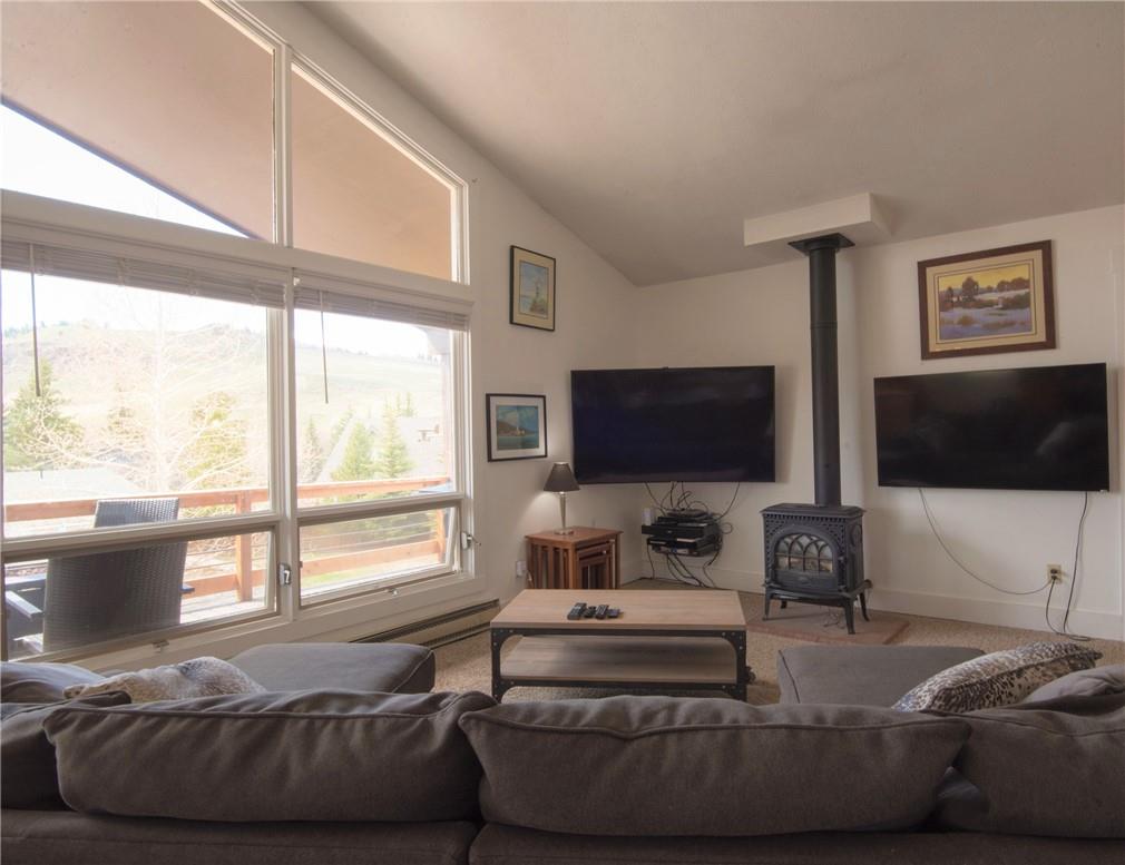 423 Big Elk Road Dillon, CO 80435 - Photo 7 of 35 a living room with furniture and a flat screen tv