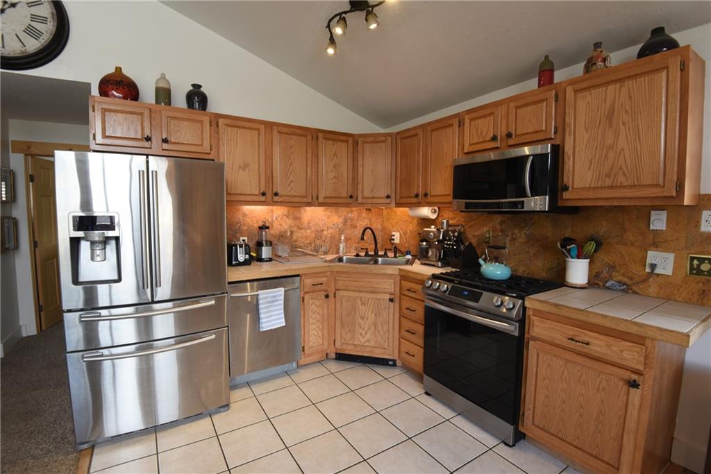 423 Big Elk Road Dillon, CO 80435 - Photo 8 of 35 a kitchen with a refrigerator stove and sink