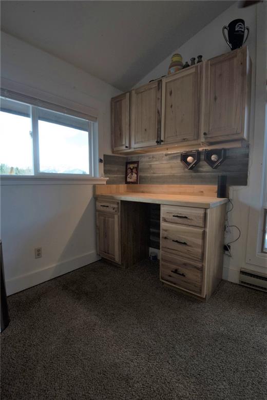 423 Big Elk Road Dillon, CO 80435 - Photo 10 of 35 a view of cabinets a sink and a stove in a room
