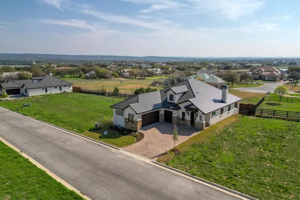 an aerial view of a house with a garden