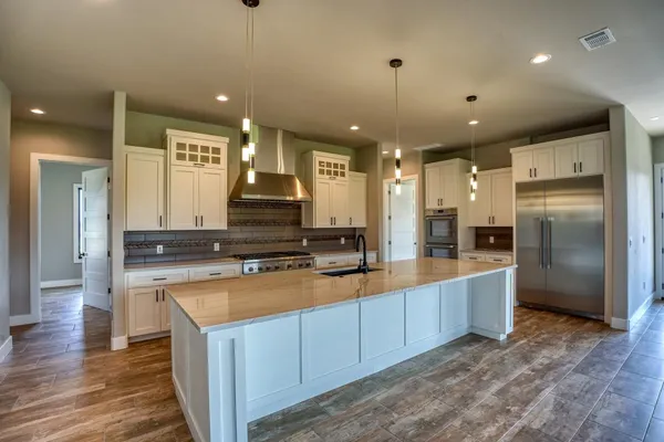 a kitchen with a stove and a sink