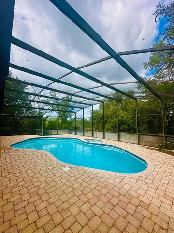 a view of swimming pool with a yard