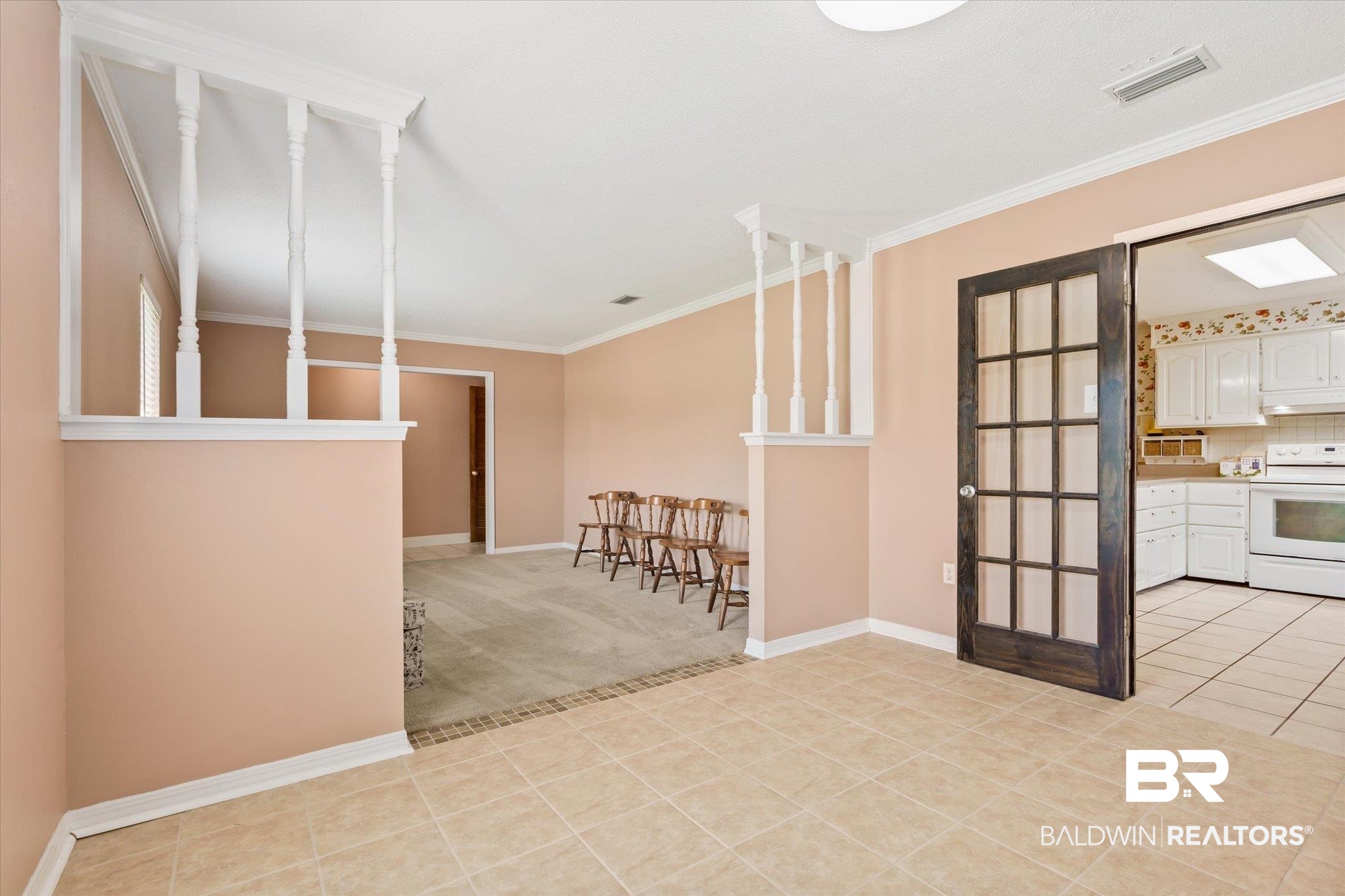 1604 Celeste Road Saraland, AL 36571 - Photo 6 of 31 Interior space with light tile patterned floors and crown molding