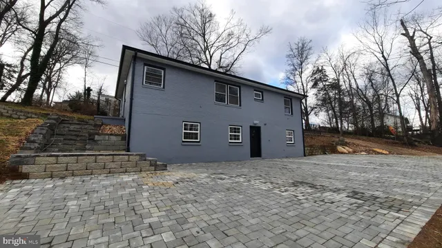 a house with trees in front of it