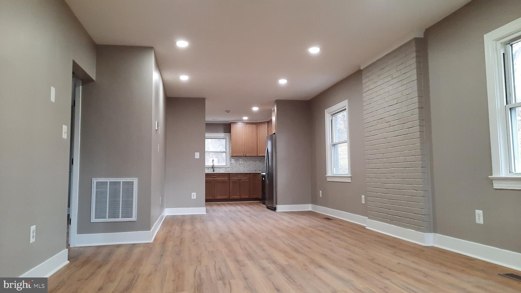 373 Bowman Road Front Royal, VA 22630 - Photo 6 of 28 a view of empty room with wooden floor and fan