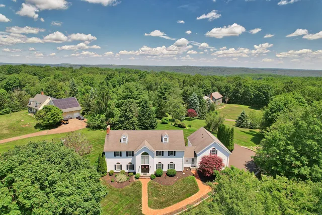 an aerial view of a house with a garden