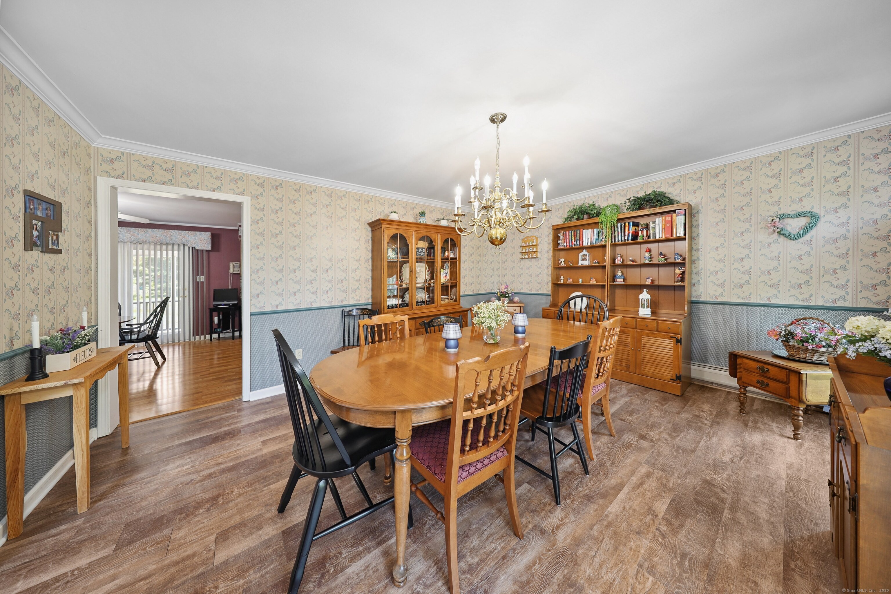 21 Hidden Pond Drive Watertown, CT 06795 - Photo 12 of 40 a view of a dining room with furniture and wooden floor