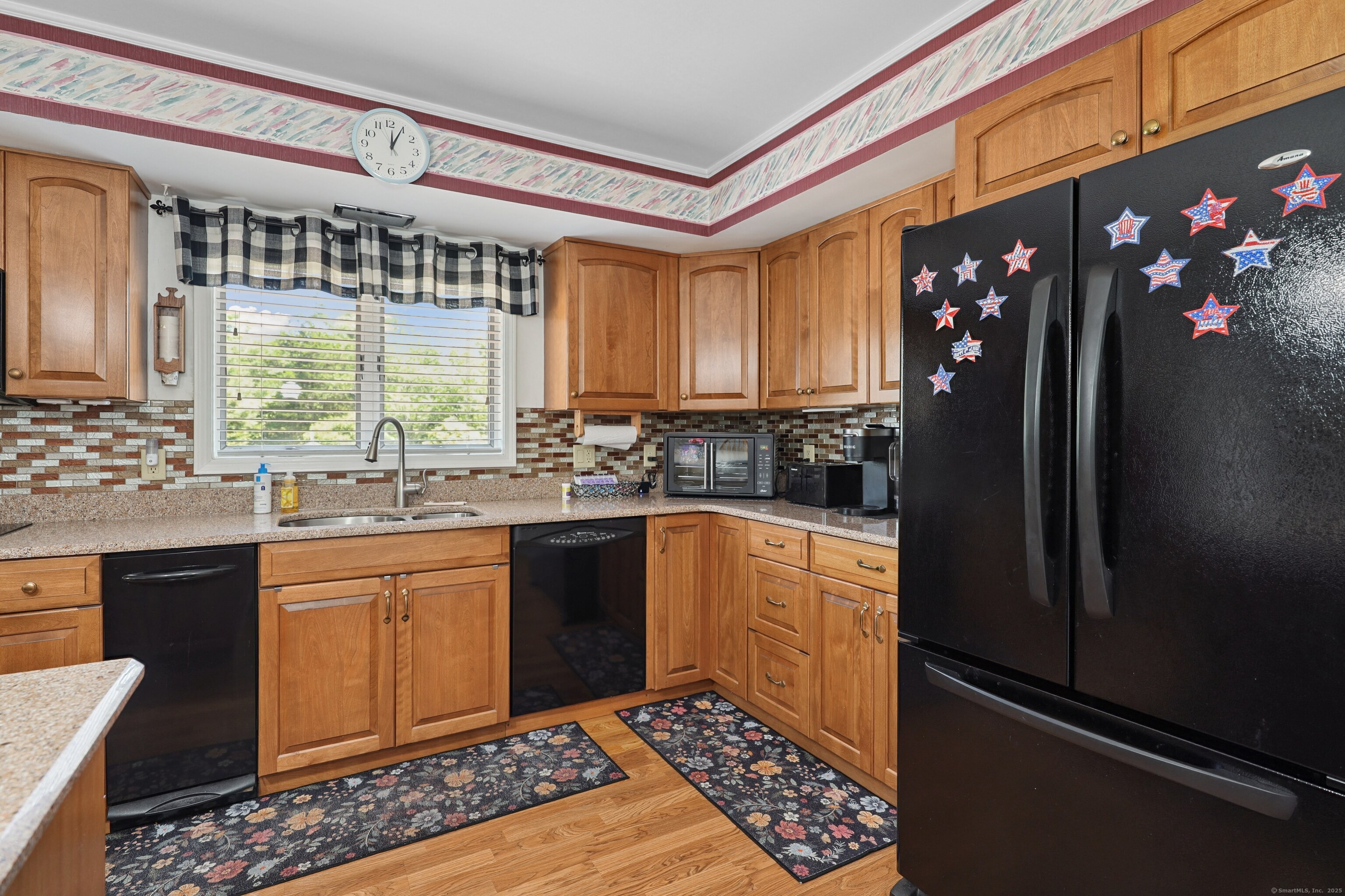 21 Hidden Pond Drive Watertown, CT 06795 - Photo 14 of 40 a kitchen with granite countertop a refrigerator and a sink