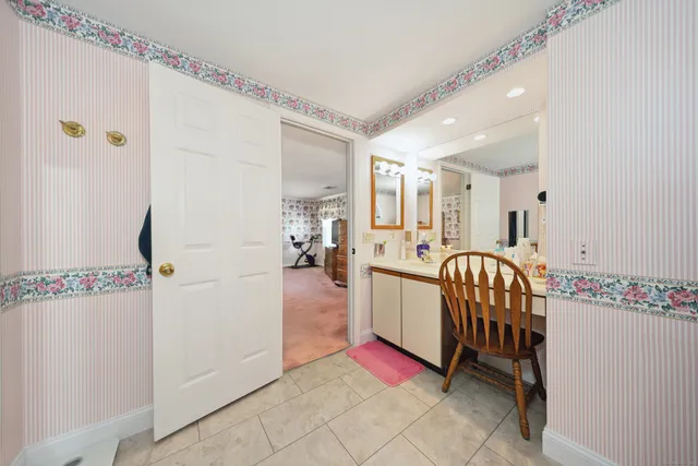 a view of a hallway with a dining area