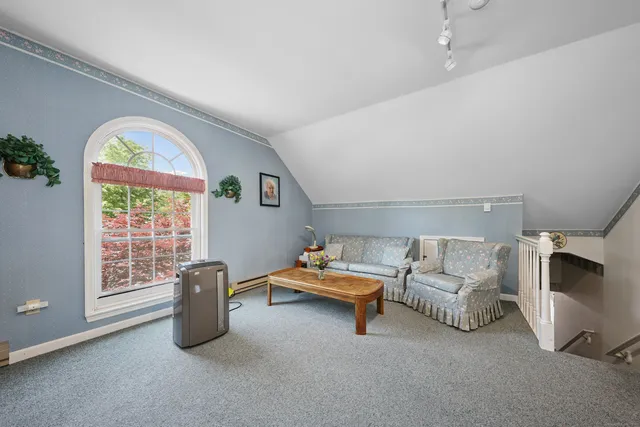 a bedroom with furniture and a window