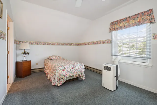 a room with a bed and a window