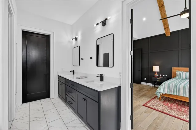a bathroom with a sink and a mirror