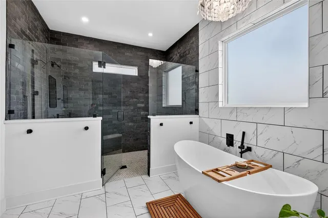 a spacious bathroom with a sink and a shower