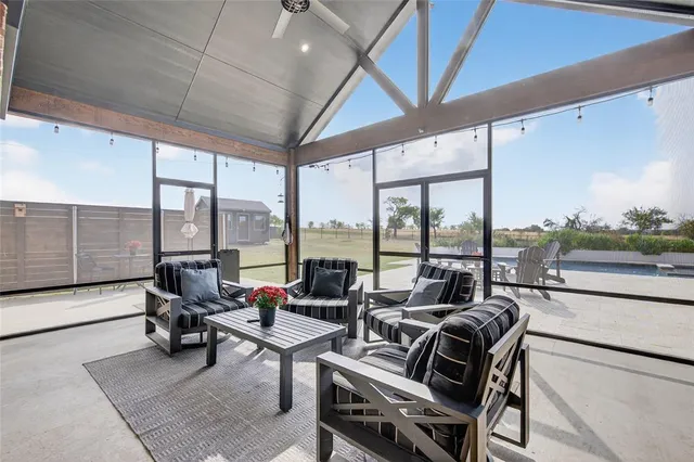a living room with furniture fireplace and flat screen tv