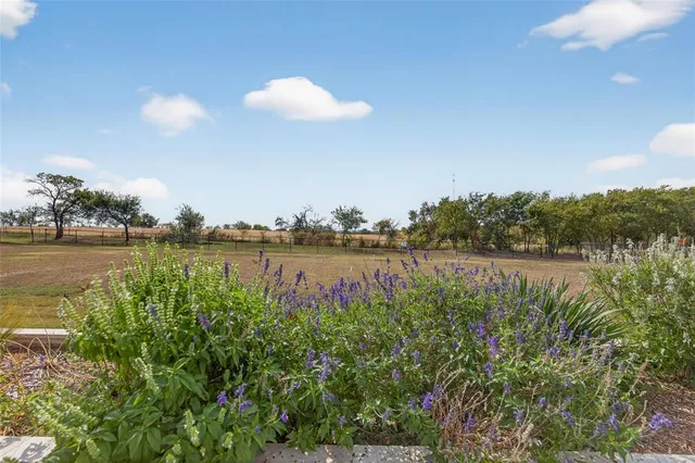 a view of house with outdoor space and lake view