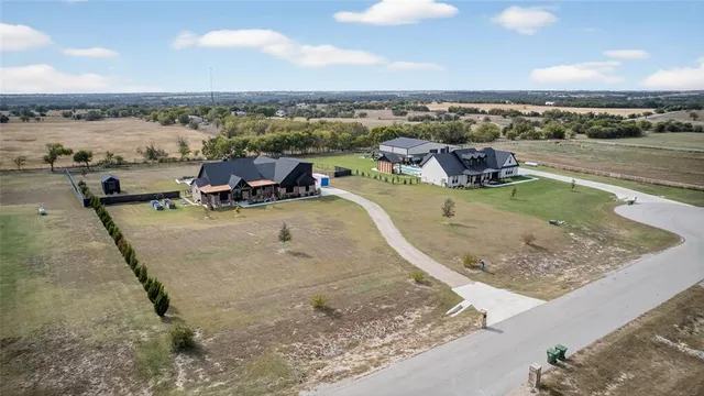 a front view of house with yard and ocean view