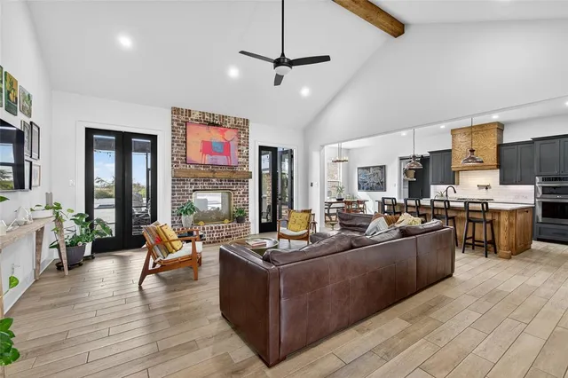 a living room with fireplace furniture and a flat screen tv