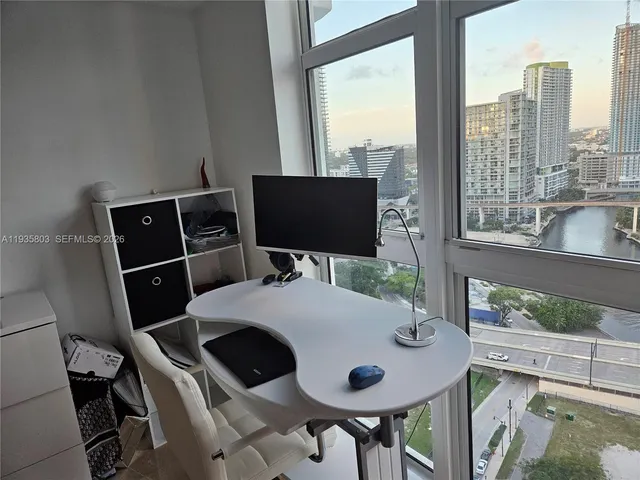 a view of a workspace with furniture