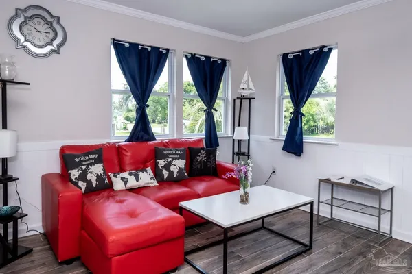 a living room with furniture and a window