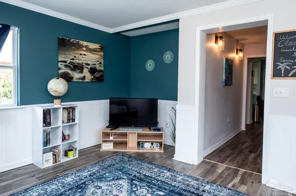 a view of living room with furniture and flat screen tv