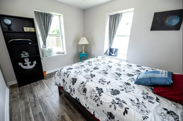 a bedroom with a bed and a window