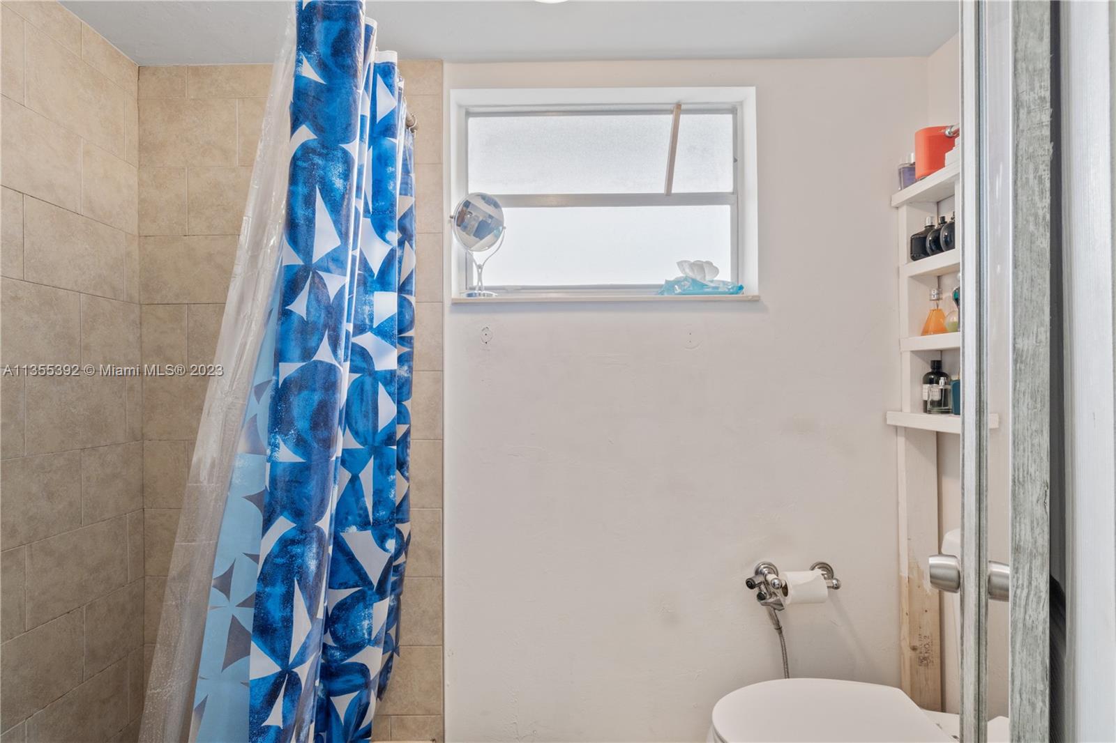 14140 Southwest 84th Street, Unit 208H Miami, FL 33183 - Photo 12 of 29 a bathroom with a shower and a window