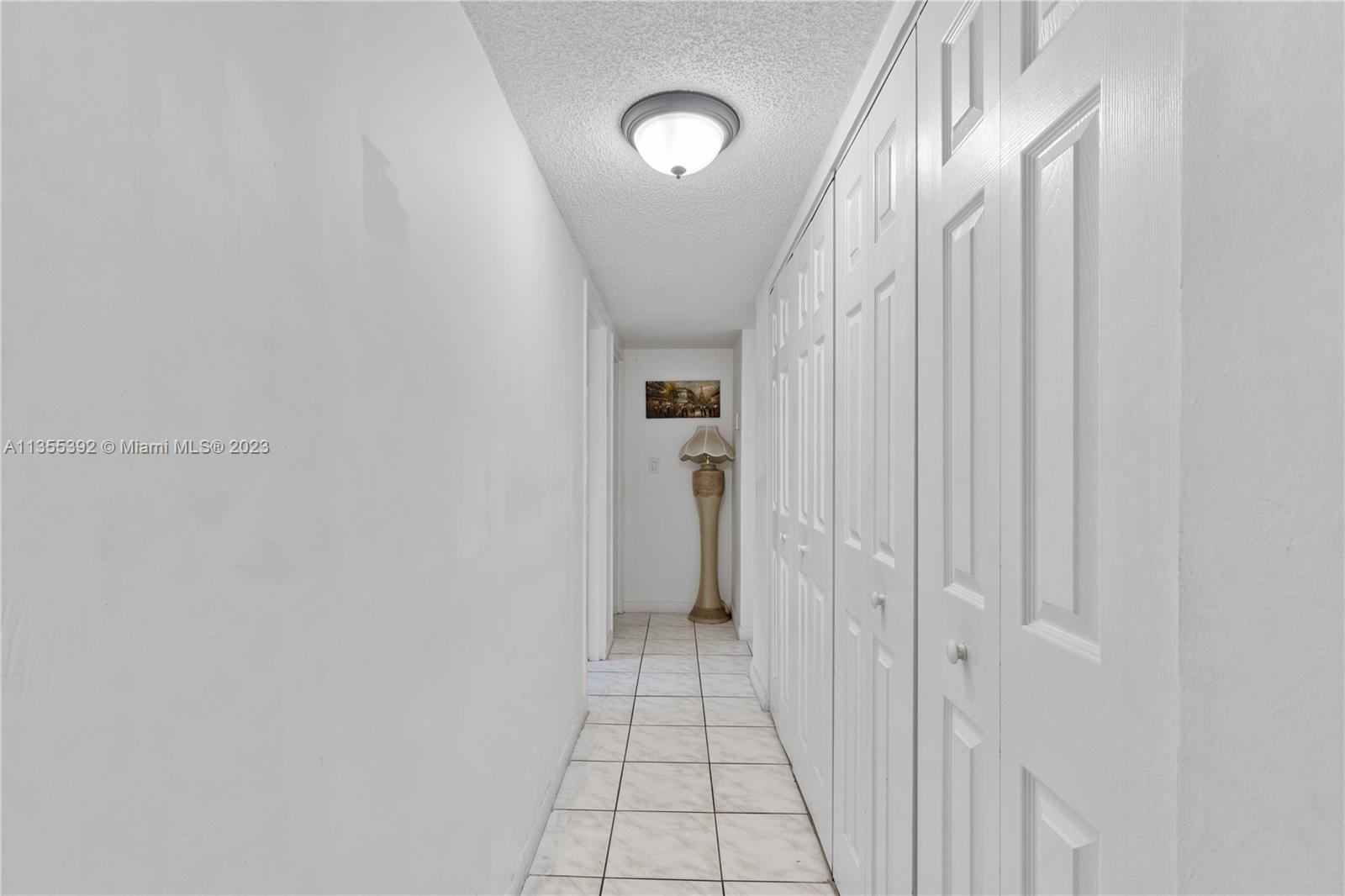 14140 Southwest 84th Street, Unit 208H Miami, FL 33183 - Photo 15 of 29 a view of a hallway