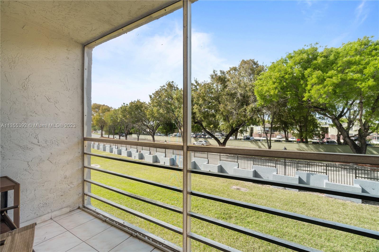 14140 Southwest 84th Street, Unit 208H Miami, FL 33183 - Photo 18 of 29 a view of a street from a balcony