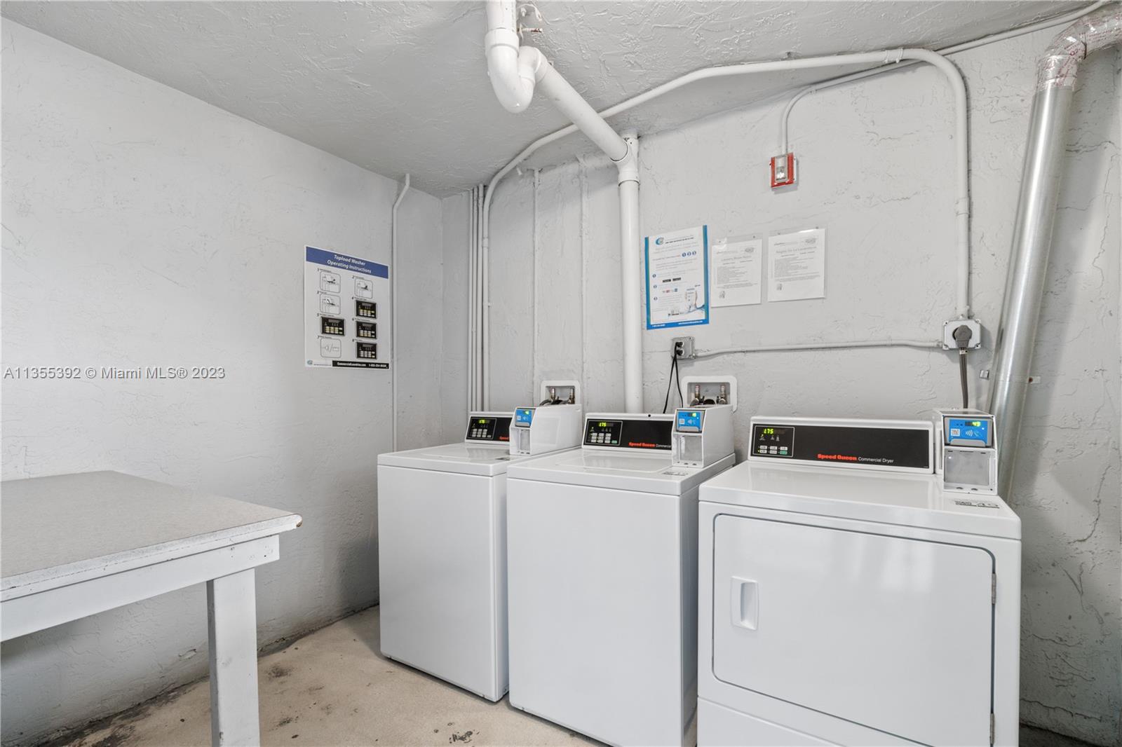 14140 Southwest 84th Street, Unit 208H Miami, FL 33183 - Photo 21 of 29 a utility room with dryer and washer