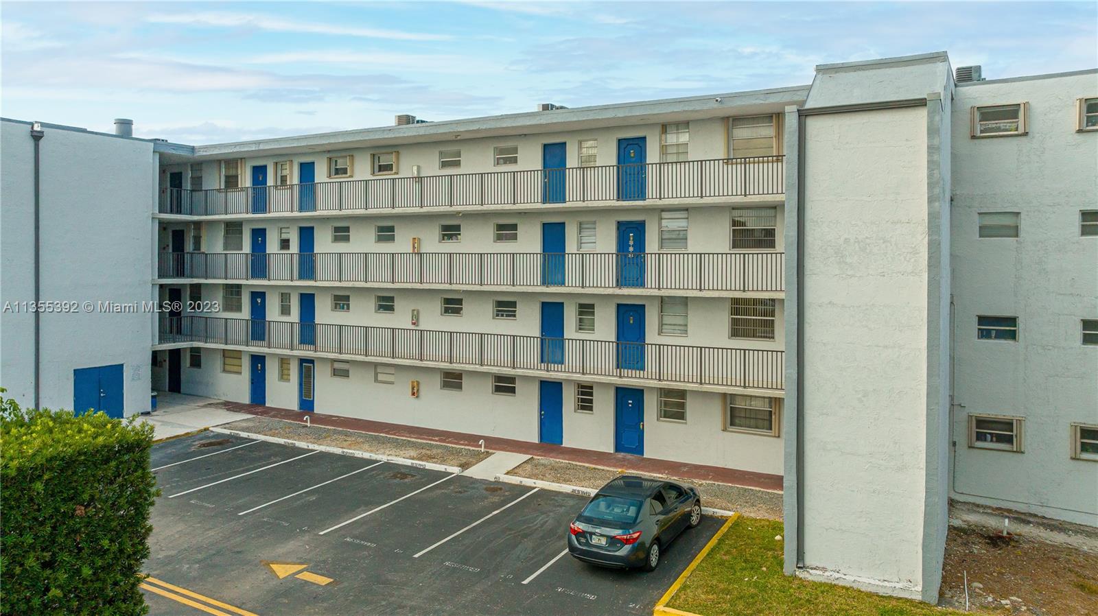 14140 Southwest 84th Street, Unit 208H Miami, FL 33183 - Photo 29 of 29 a view of a large room with windows