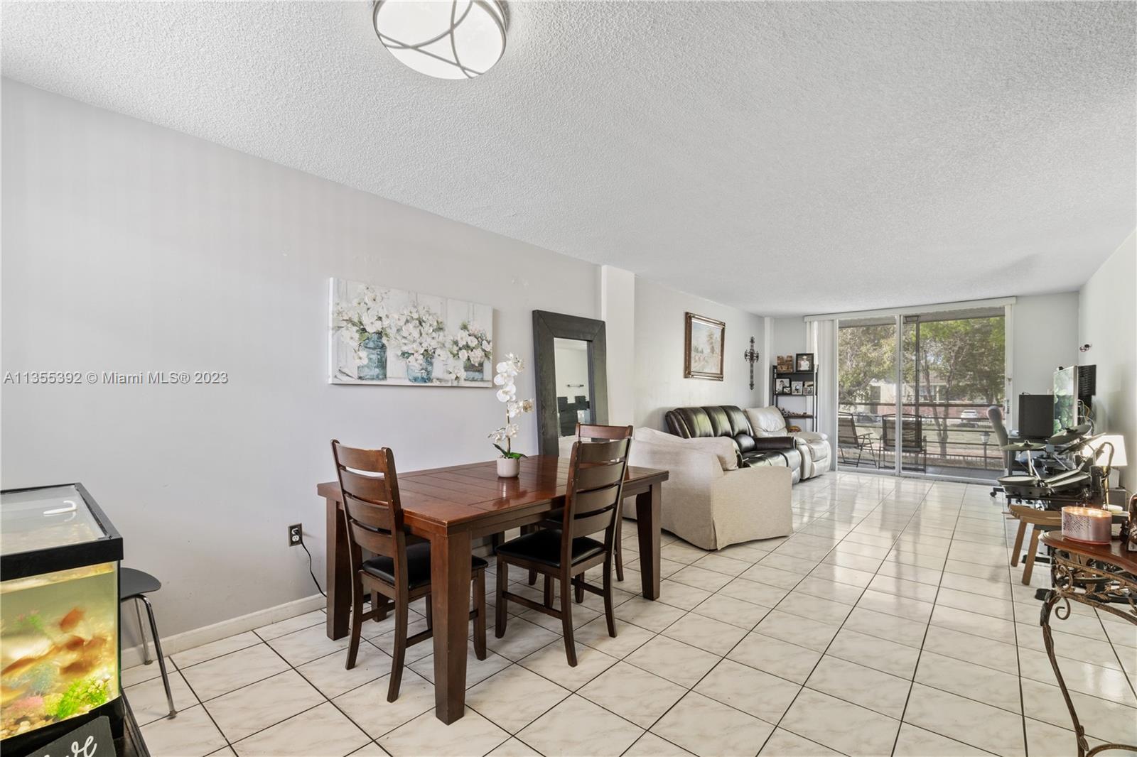 14140 Southwest 84th Street, Unit 208H Miami, FL 33183 - Photo 3 of 29 a view of a dining room with furniture