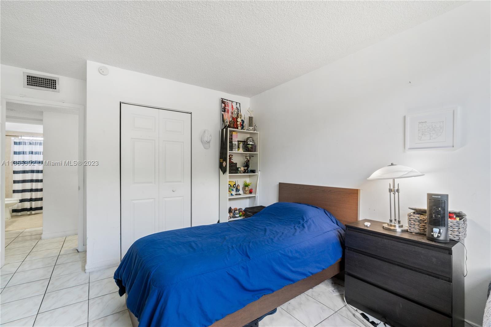 14140 Southwest 84th Street, Unit 208H Miami, FL 33183 - Photo 10 of 29 a bedroom with a bed and closet