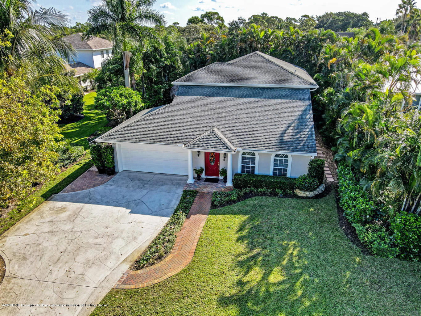 a aerial view of a house next to a yard
