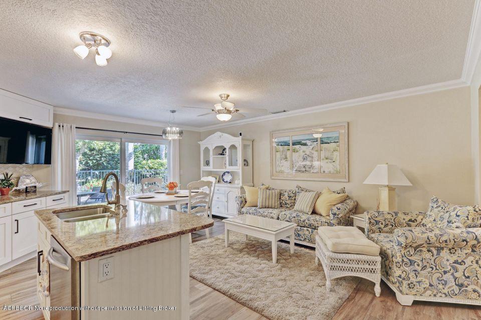 18905 Southeast County Line Road Jupiter, FL 33469 - Photo 13 of 74 a living room with furniture and a large window