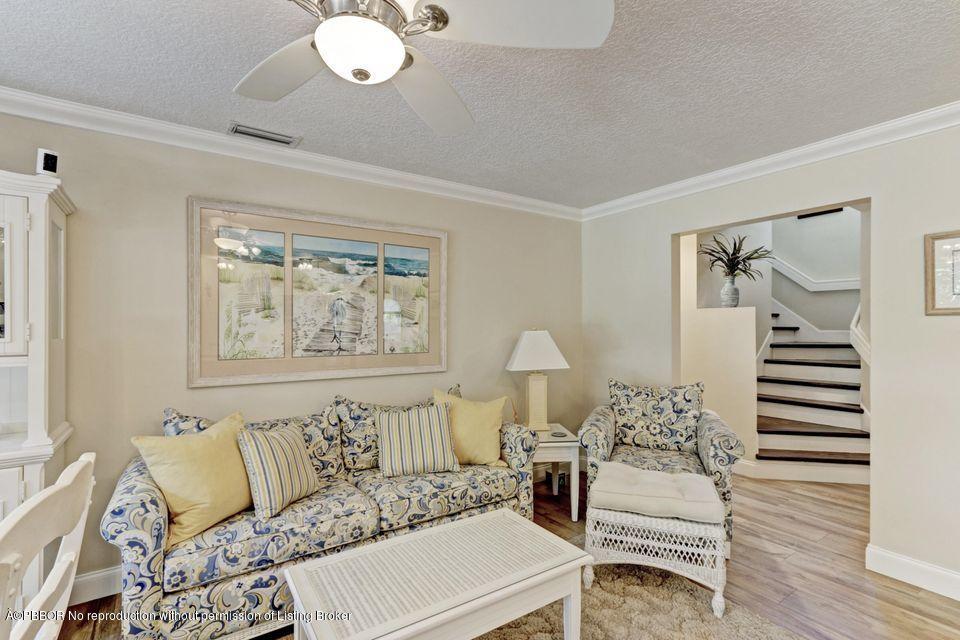 18905 Southeast County Line Road Jupiter, FL 33469 - Photo 15 of 74 a living room with furniture and wooden floor