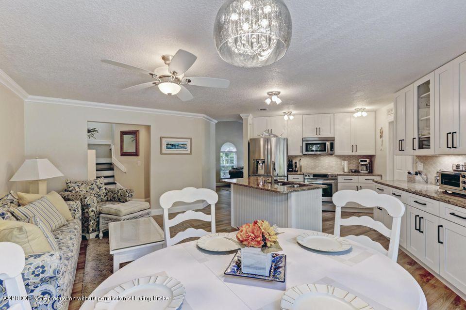 18905 Southeast County Line Road Jupiter, FL 33469 - Photo 18 of 74 a living room with furniture kitchen view and a window
