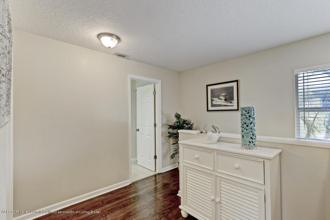 18905 Southeast County Line Road Jupiter, FL 33469 - Photo 36 of 74 a room with a sink and a mirror