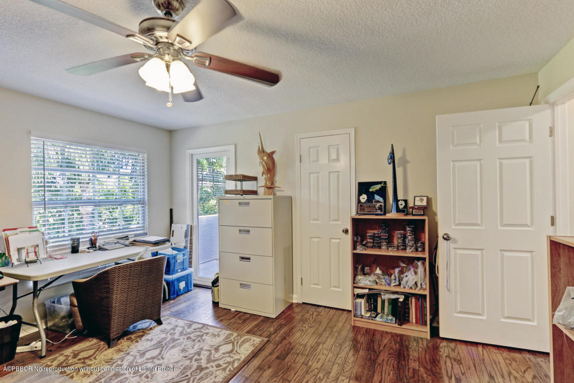 18905 Southeast County Line Road Jupiter, FL 33469 - Photo 41 of 74 a view of a workspace with furniture and a window