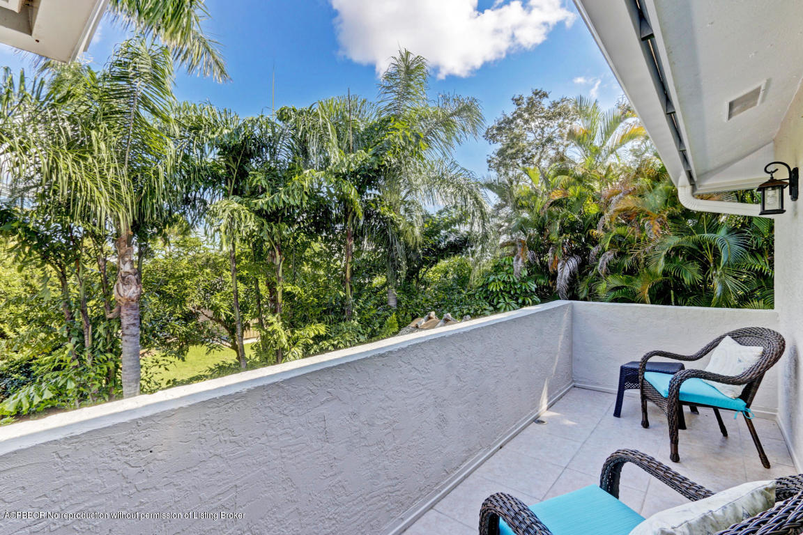 18905 Southeast County Line Road Jupiter, FL 33469 - Photo 45 of 74 a view of a chairs and table in a balcony