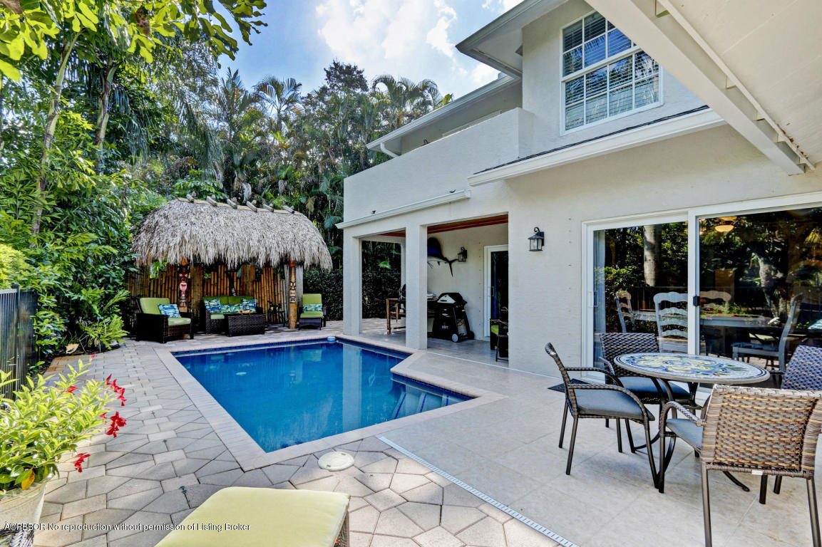 18905 Southeast County Line Road Jupiter, FL 33469 - Photo 51 of 74 a view of a house with swimming pool and sitting area
