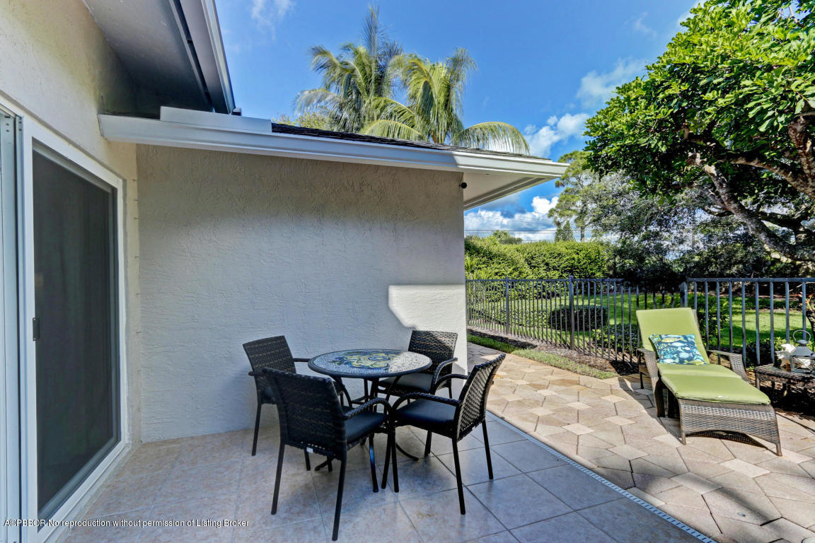 18905 Southeast County Line Road Jupiter, FL 33469 - Photo 52 of 74 a view of a chairs and table in the patio