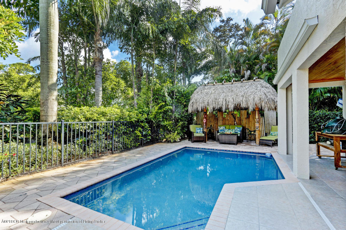 18905 Southeast County Line Road Jupiter, FL 33469 - Photo 53 of 74 a view of swimming pool with sitting area
