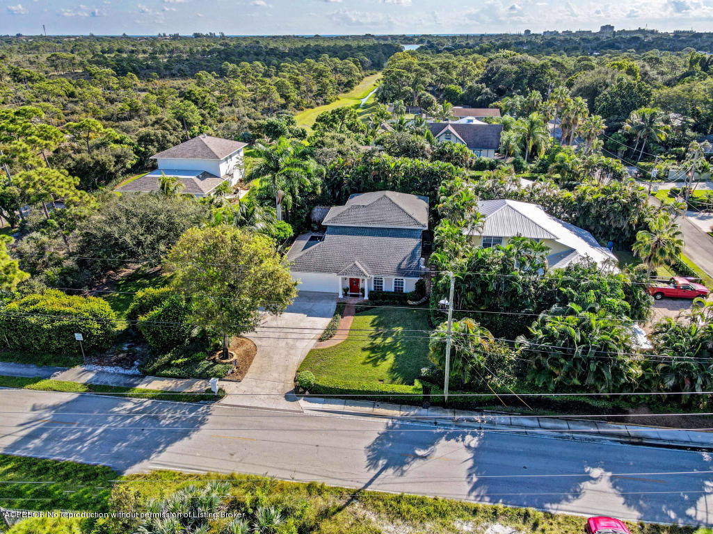 18905 Southeast County Line Road Jupiter, FL 33469 - Photo 61 of 74 an aerial view of a house with yard swimming pool and outdoor seating