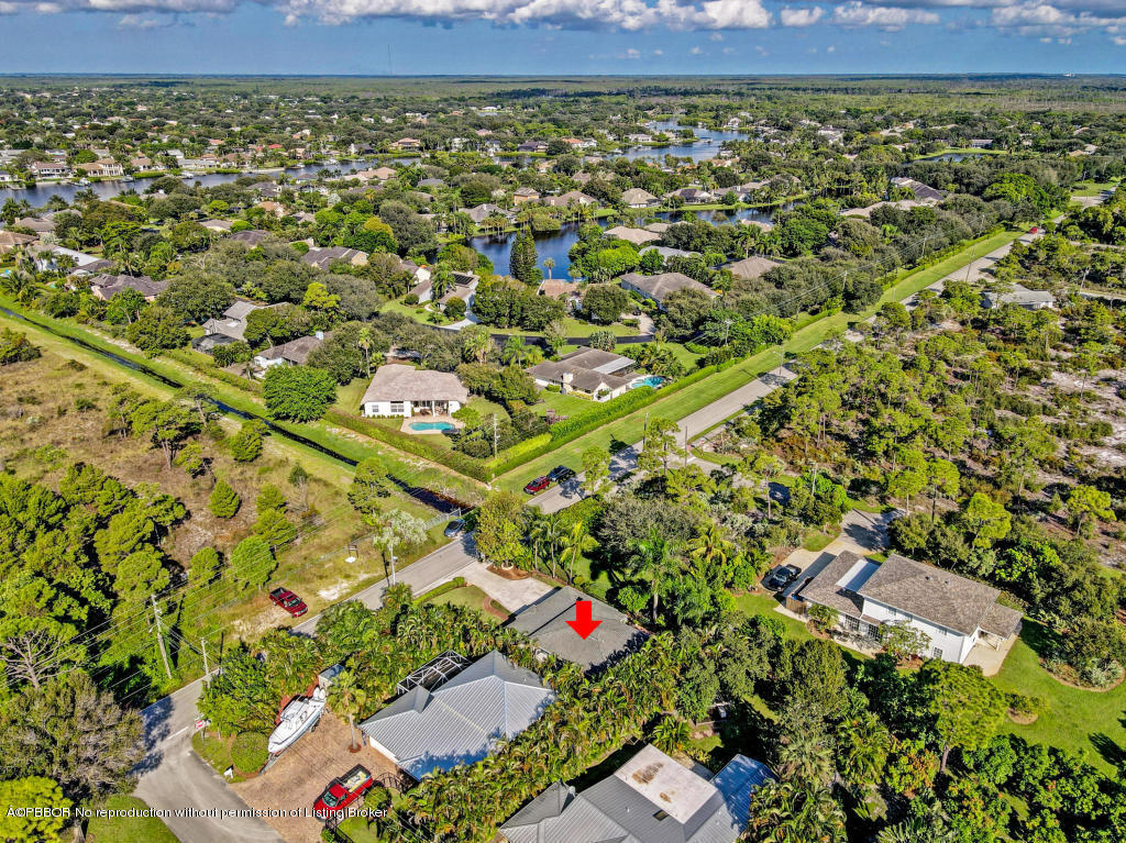 18905 Southeast County Line Road Jupiter, FL 33469 - Photo 68 of 74 an aerial view of a residential houses with yard and outdoor space