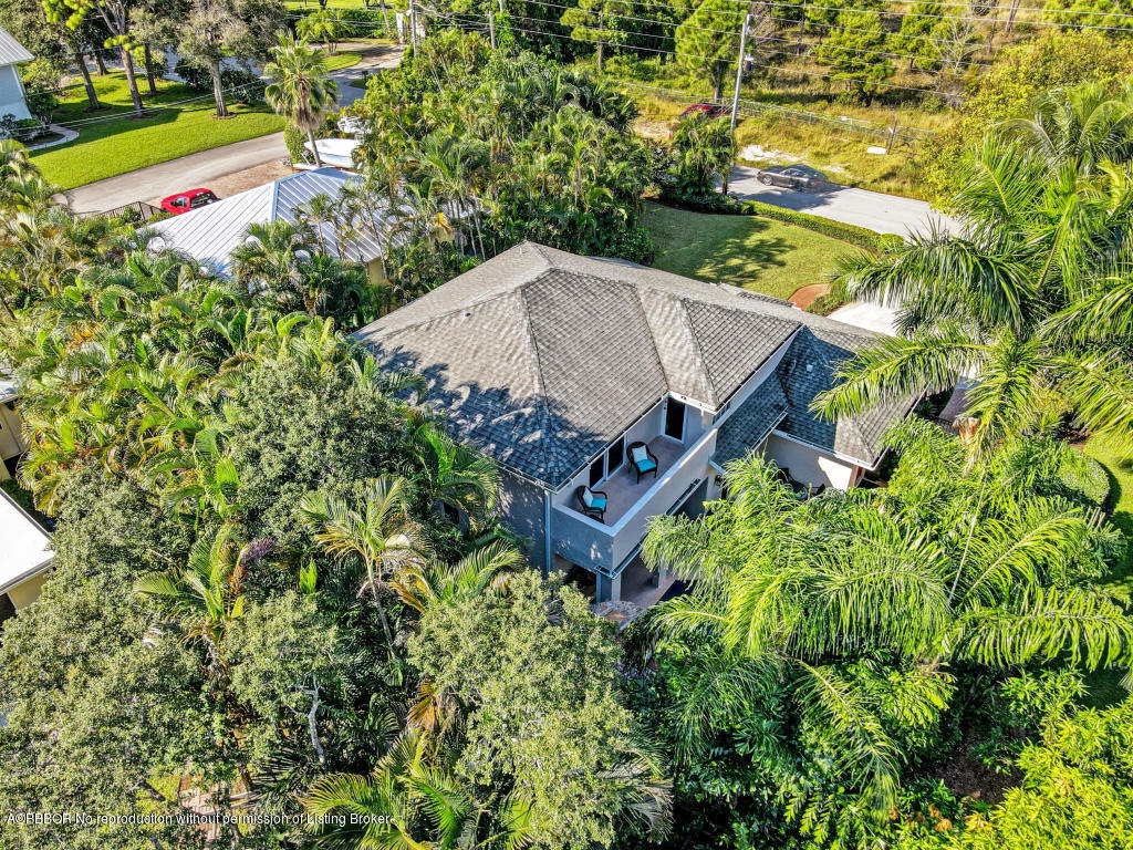 18905 Southeast County Line Road Jupiter, FL 33469 - Photo 74 of 74 an aerial view of a house with a yard basket ball court and outdoor seating