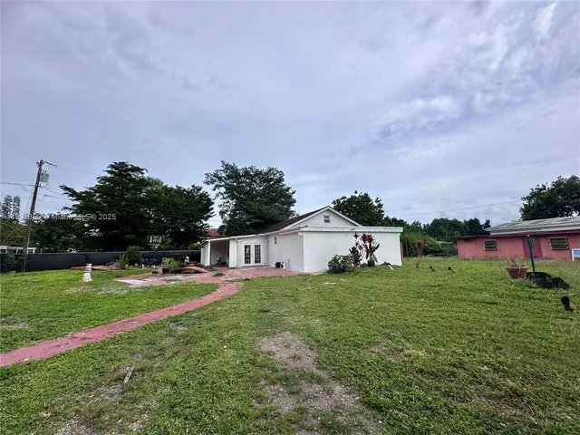 a house view with a garden space