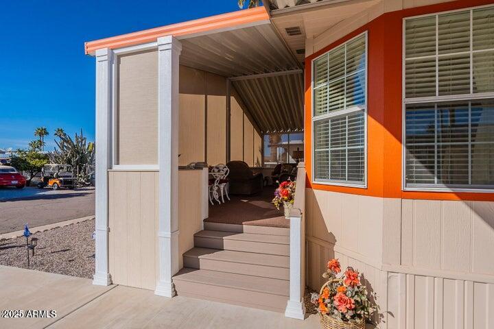 201 South Greenfield Road, Unit 176 Mesa, AZ 85206 - Photo 10 of 61 a view of a house with a potted plant