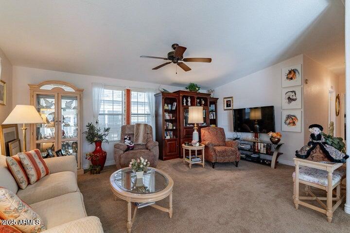 201 South Greenfield Road, Unit 176 Mesa, AZ 85206 - Photo 15 of 61 a living room with furniture a flat screen tv and a large window